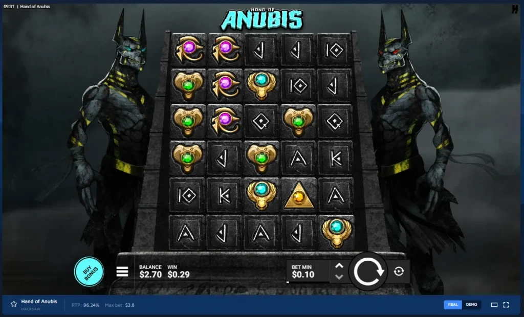 Hand of Anubis gameplay: 5x6 stone grid flanked by dark Anubis statues, jewel icons, and spin controls.